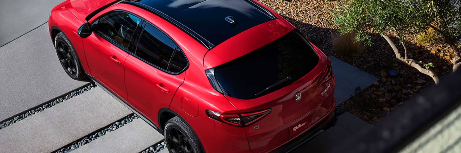 Top angled rear view of a red Alfa Romeo Stelvio