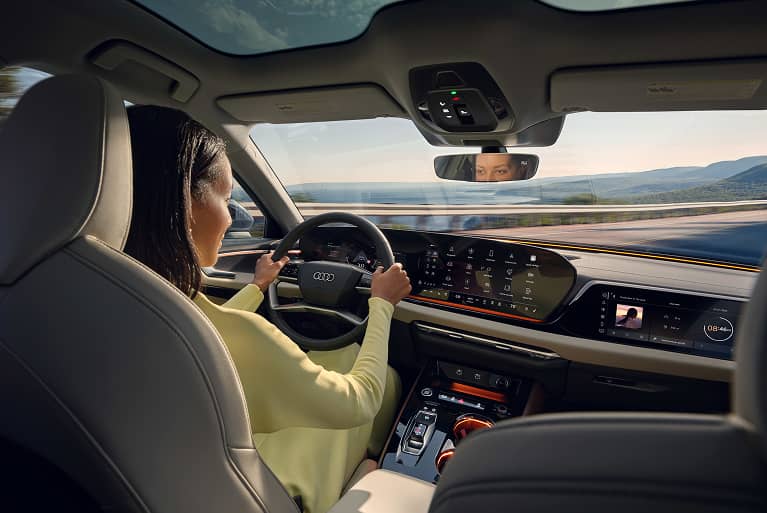 Woman driving audi vehicle