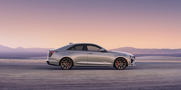 Side Profile View of a Silver 2025 CT4 Parked in the Open Desert