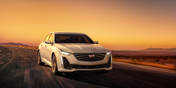 Front view of 2025 Cadillac CT5 driving up road 