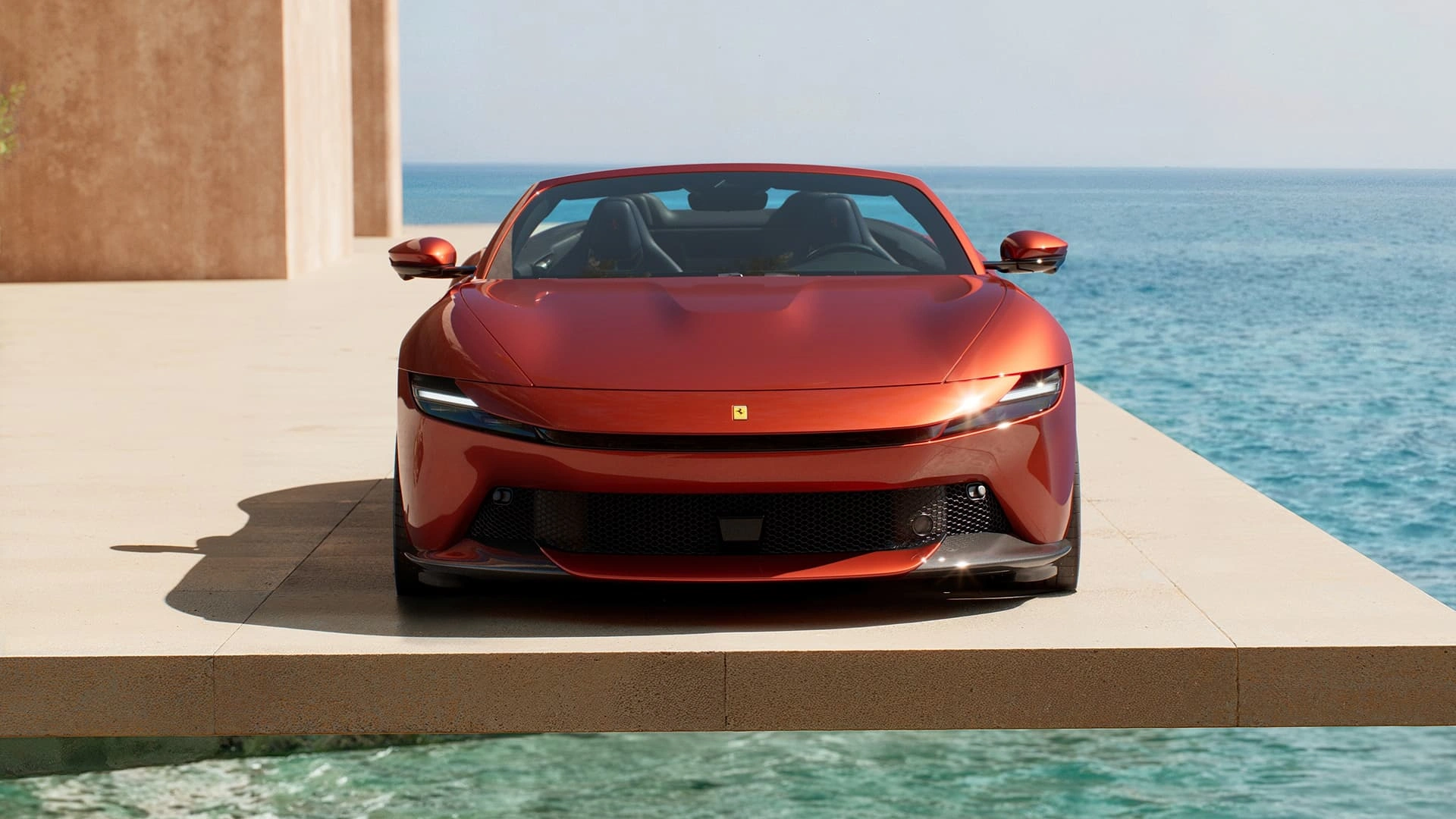 Ferrari Amalfi Spider in red, straight-on front view, parked on a seaside terrace