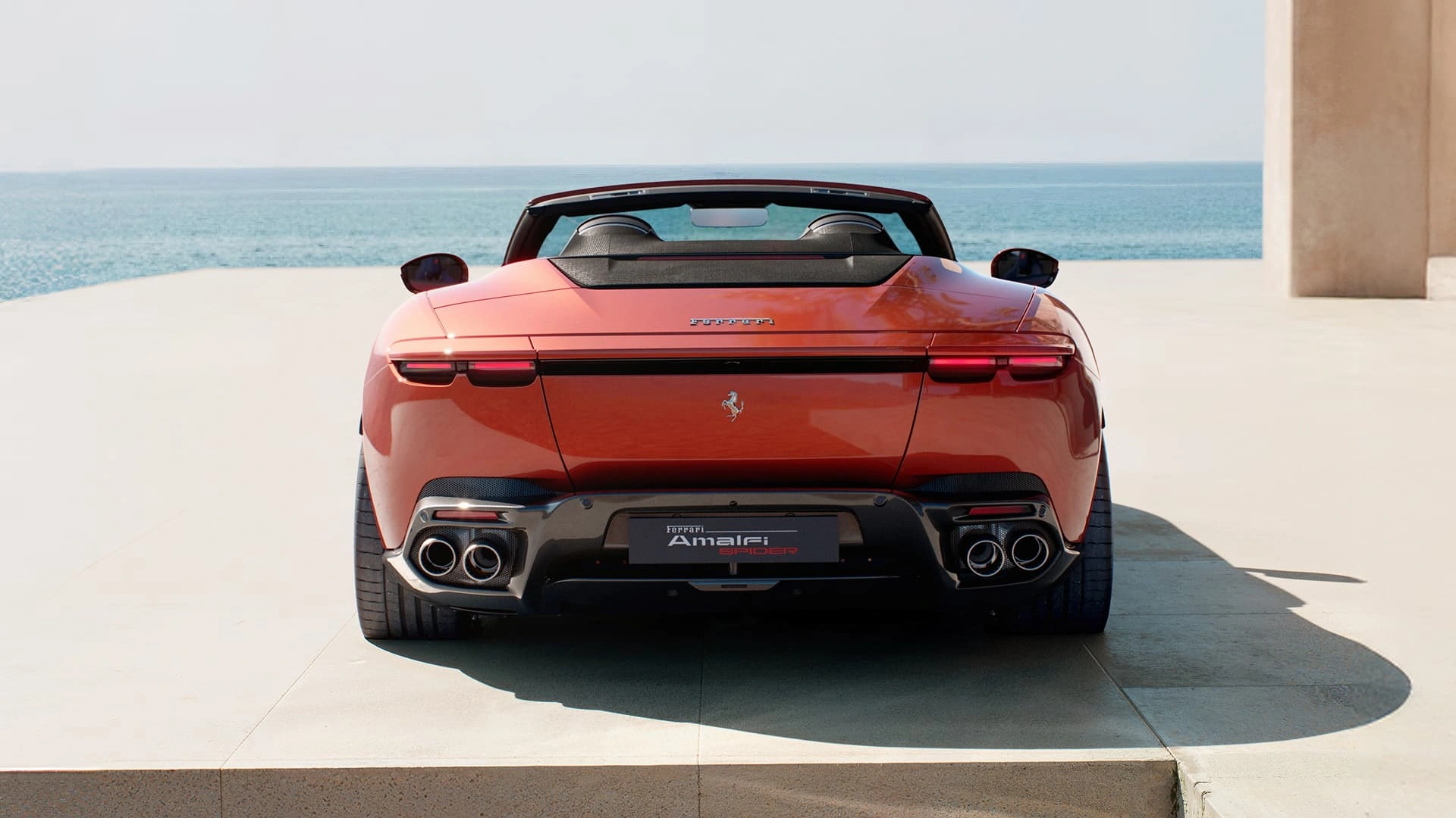 Ferrari Amalfi Spider in red, straight-on rear view showing dual exhaust tips and model badge