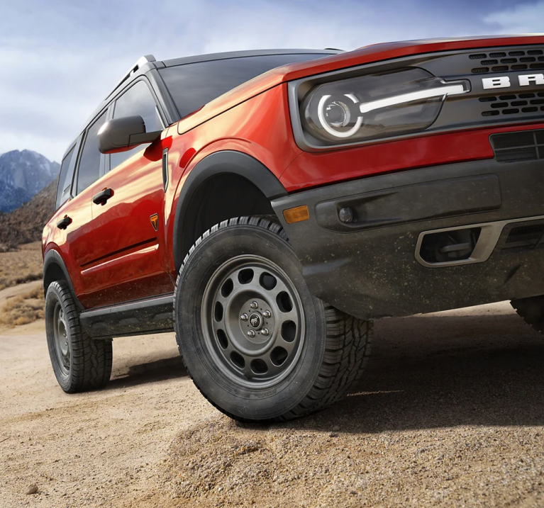 Close-up of a red Ford Bronco Sport parked in the desert