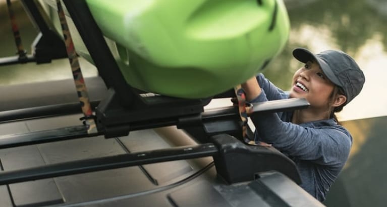 loading a kayak onto the roof rack