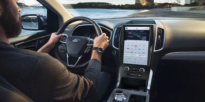 Over the shoulder shot of the driver's seat and console