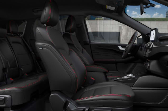 Front interior view of a grey Ford Escape showing the dashboard and front seats.