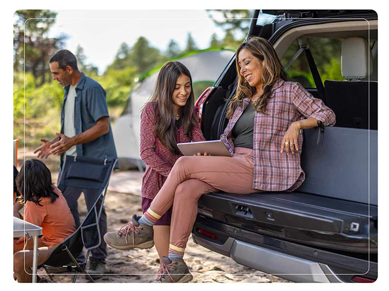 People using the 2025 Ford Expedition® Platinum® MAX SUV with the available Ford Cargo Tailgate Manager backrest