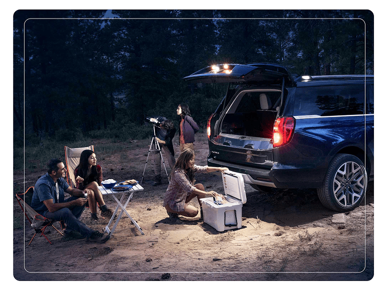 2025 Ford Expedition® Platinum® MAX SUV with available 360-Degree Zone Lighting with people nearby
