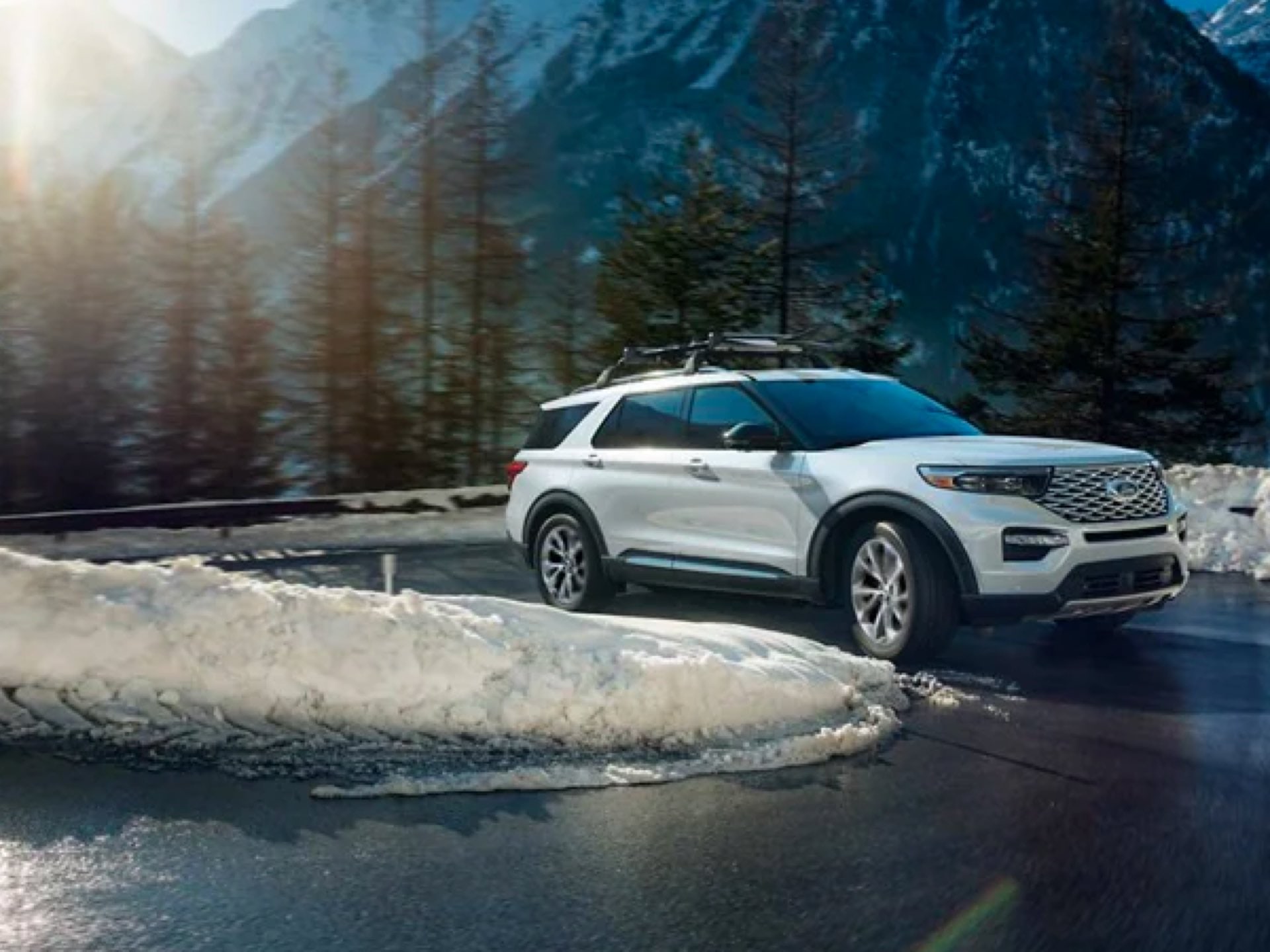 2021 Ford Explorer ST driving up a switchback mountain road
