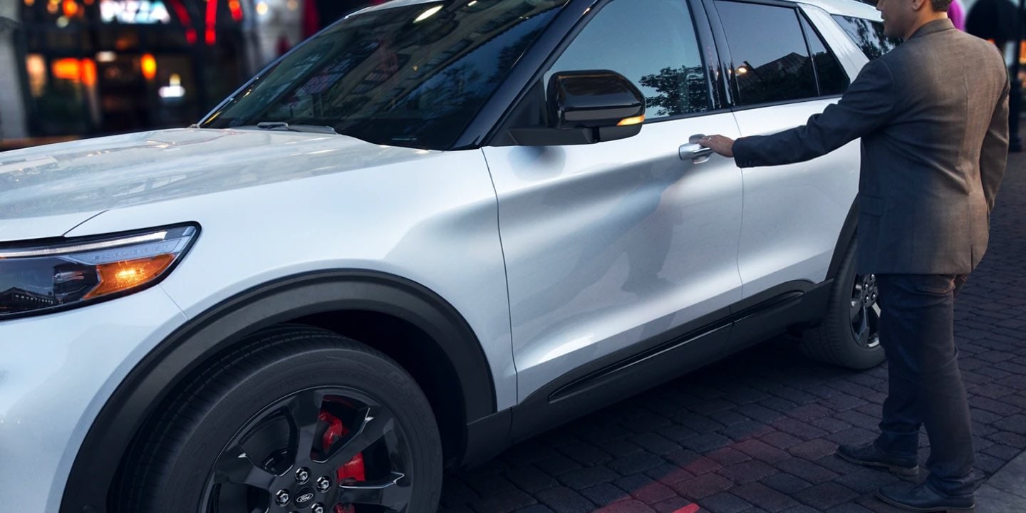 driver opening the door of a 2021 Ford Explorer ST