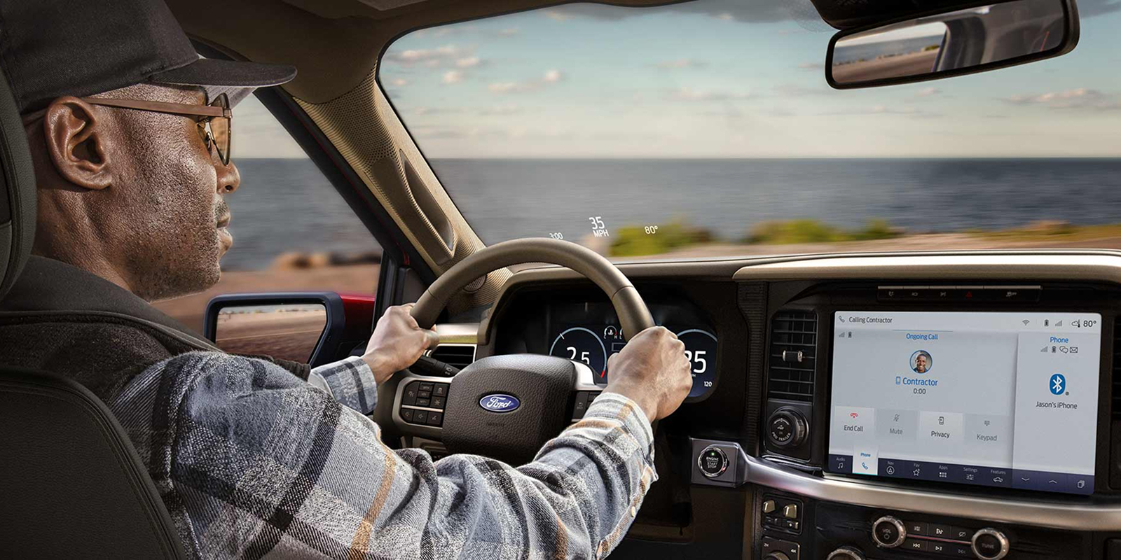 Man driving a 2025 Ford F-150® King Ranch® showing the center stack display screen