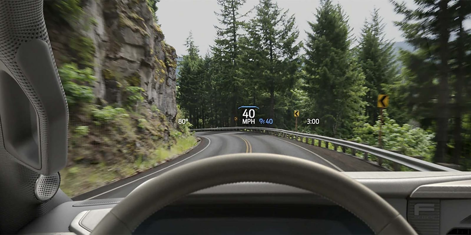 Driver perspective using head-up display feature highlighting the speed on to the windshield