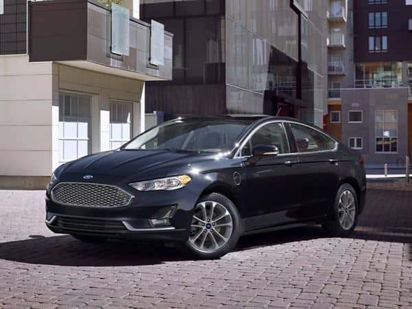 Blue Ford Fusion Hybrid parked at an angle