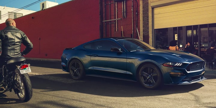 Passenger side view of 2021 Ford Mustang parked in an alley