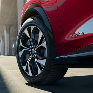 An angled shot of the rims and tires of the Mach-E Mustang