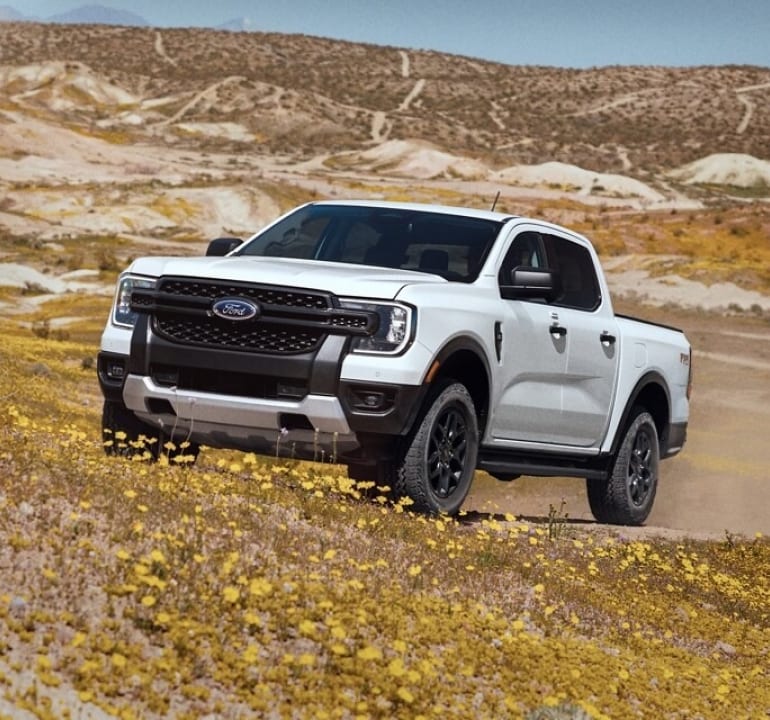 white 2024 Ford Ranger offroading