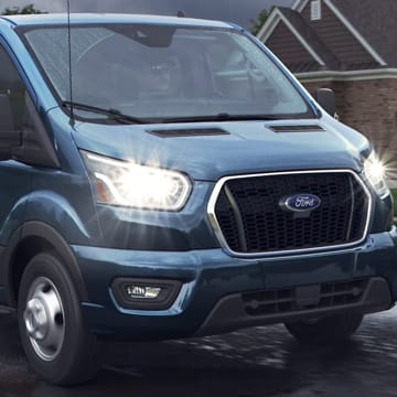 An exterior shot of a Blue Ford Transit Van.
