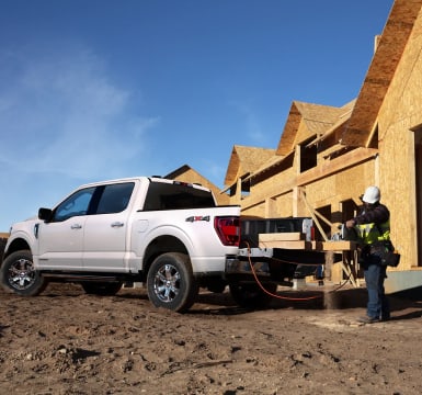 White F-150 parked at a construction site