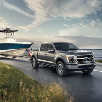 Ford F-150 towing a boat.
