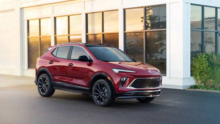 Buick SUV parked in front of a white building