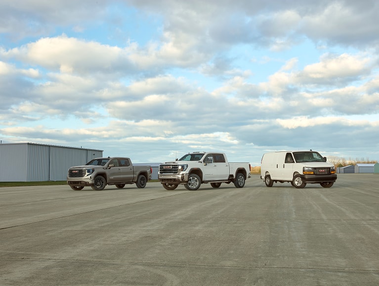 lineup of GMC Fleet trucks and vans
