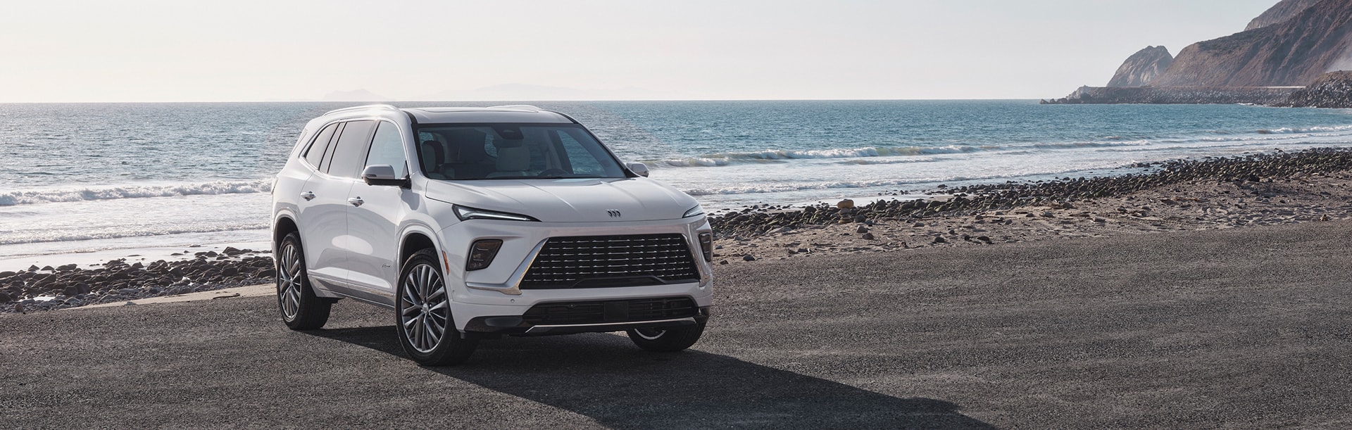Buick Enclave parked on a beach