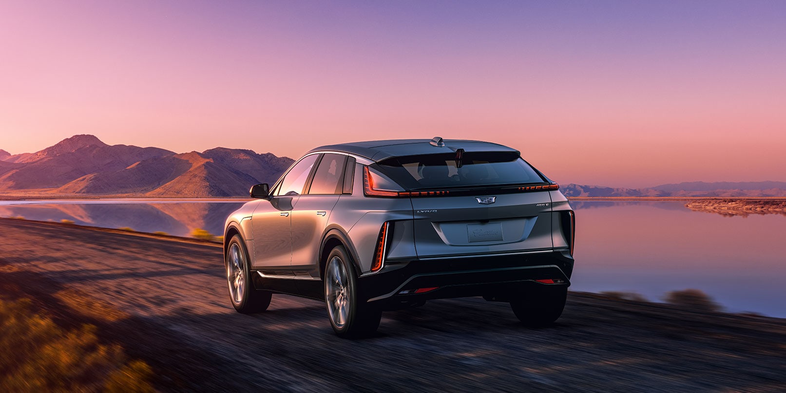 rear view of 2023 Cadillac Lyriq driving