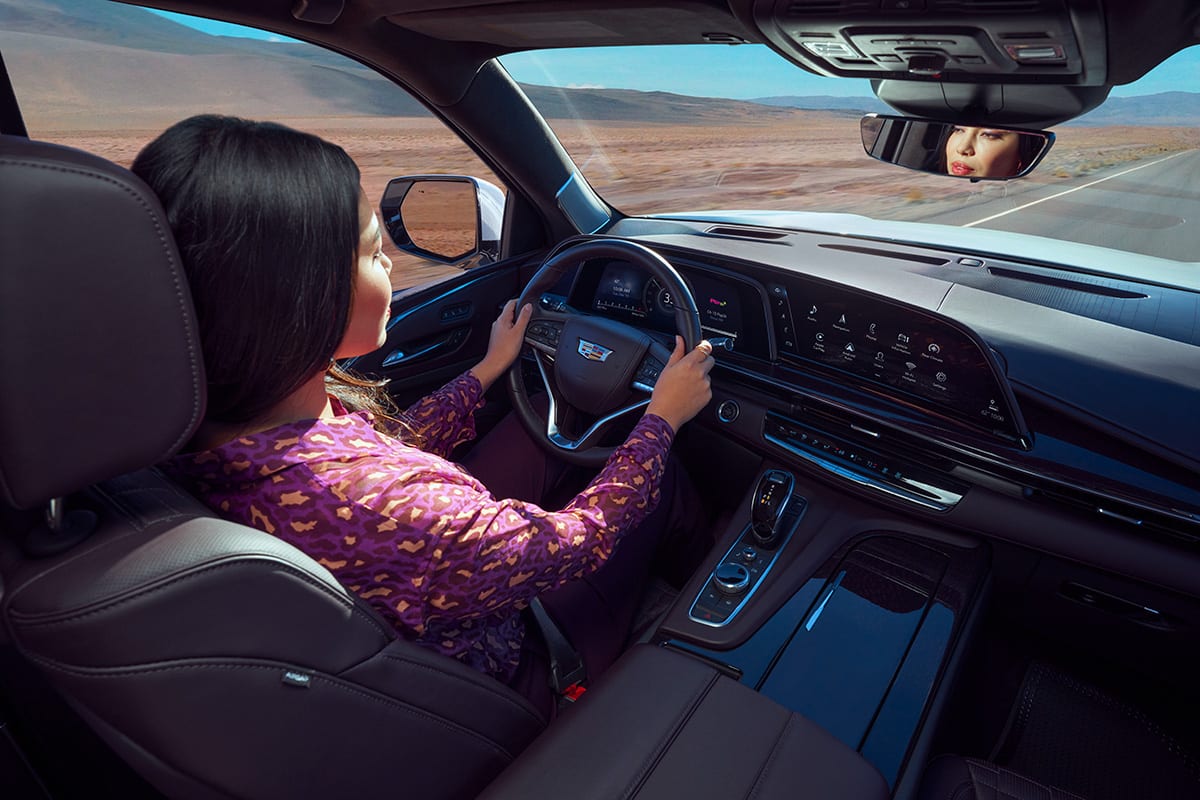 User interacting with vehicle touchscreen on dashboard