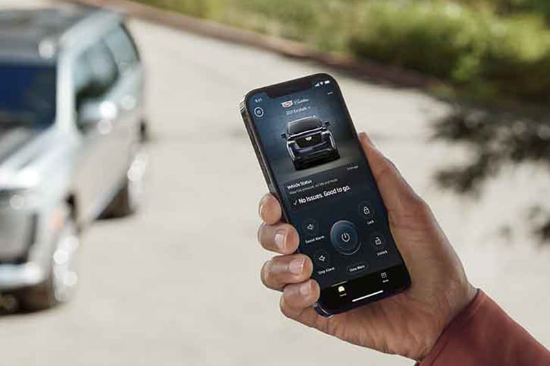 Cadillac mobile app on phone in user's hand