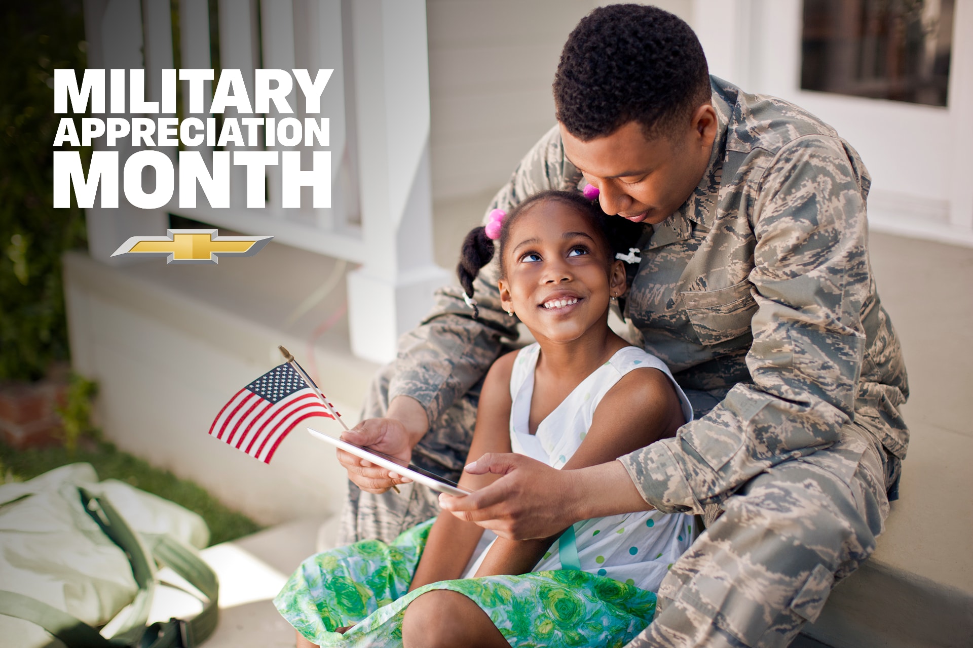 US soldier at home with his daughter