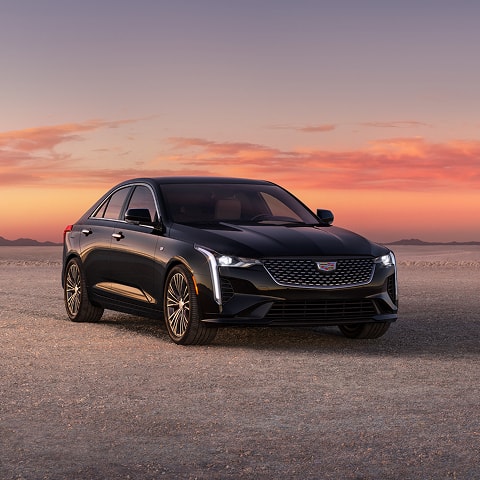 Three Quarters Front View of a Black 2026 CT4 Parked in the Open Desert