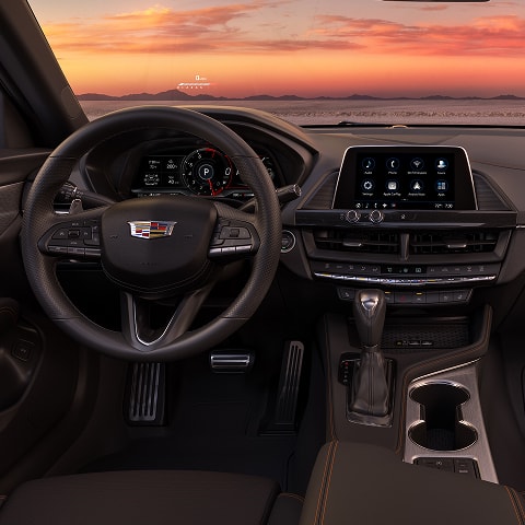 Driver's View of the 2026 CT4 Sleek Infotainment System and Steering Wheel