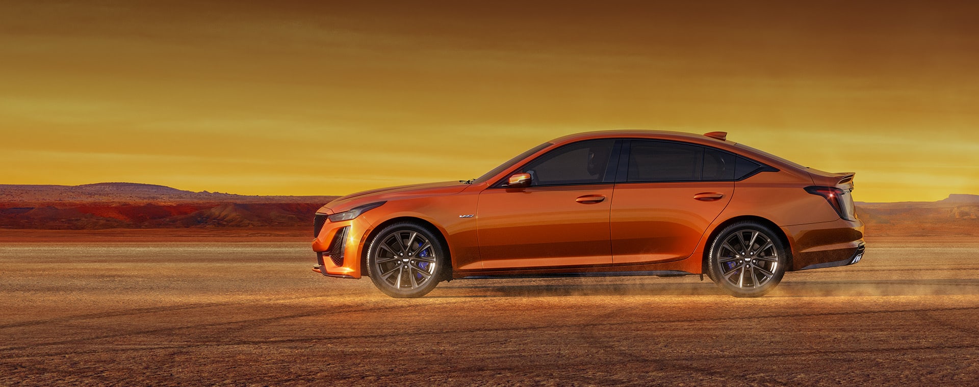 2023 Cadillac CT5-V in Blazd Orange driving in the desert