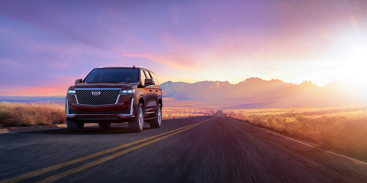 2023 Cadillac Escalade driving on a desert highway