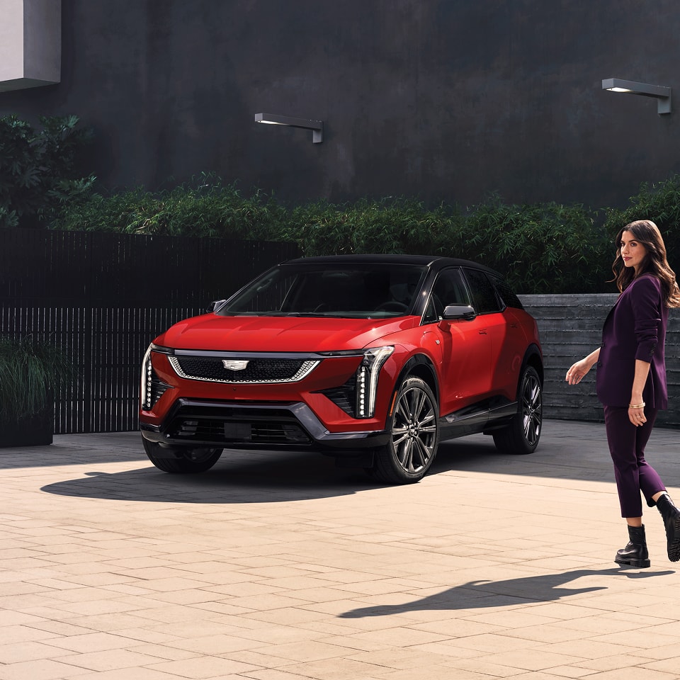 owner approaching a parked 2026 OPTIQ