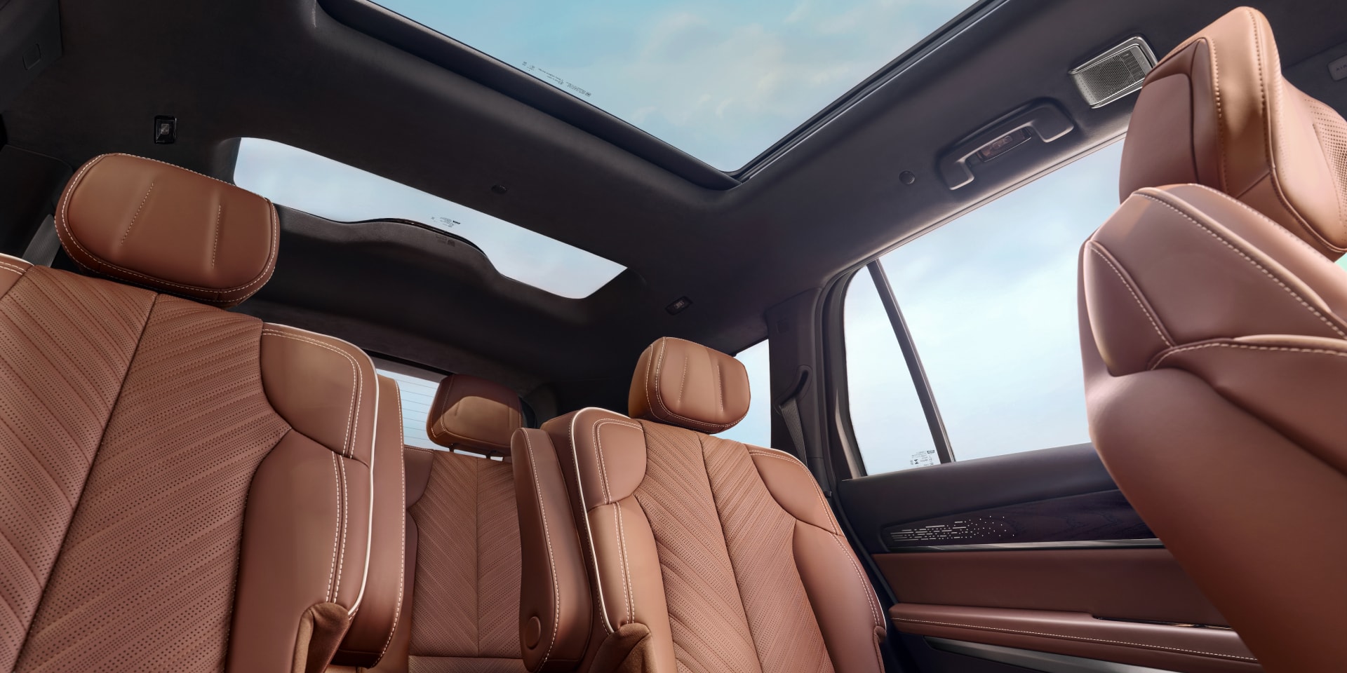 Floorboard View of the Cadillac VISTIQ's Two Brown Leather Back Rows and Dual Pane Sunroof