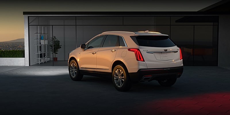 2023 Cadillac XT5 pulling into a garage at night