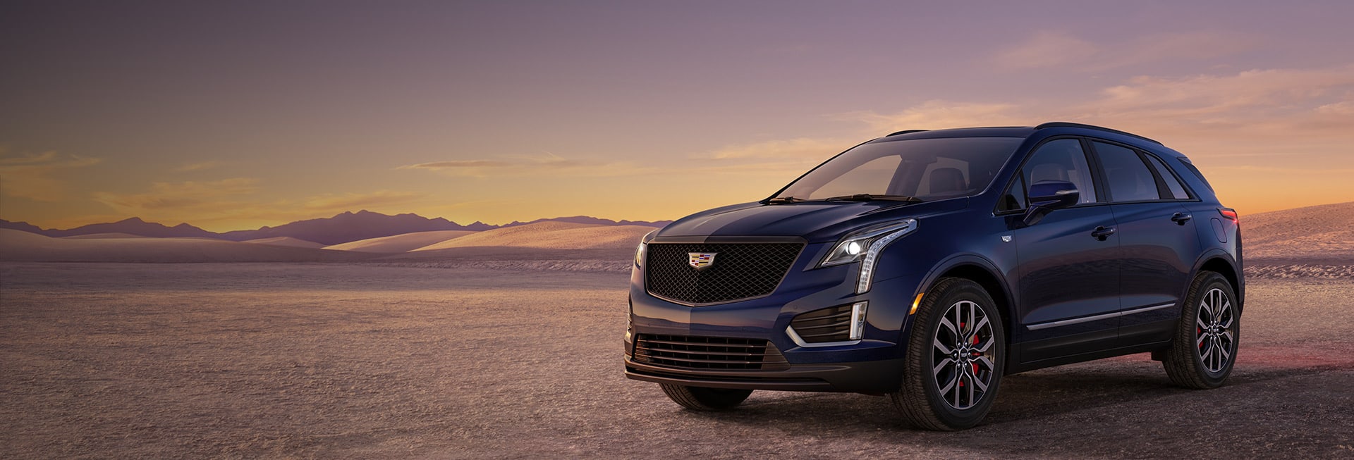 2023 Cadillac XT5 parked in the desert at sunset