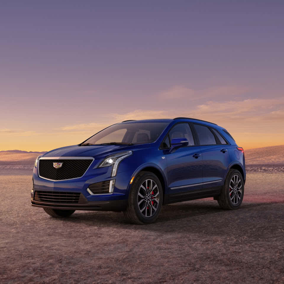 The Dark Moon Blue Metallic Cadillac XT5 Parked During the Sunset in Desert
