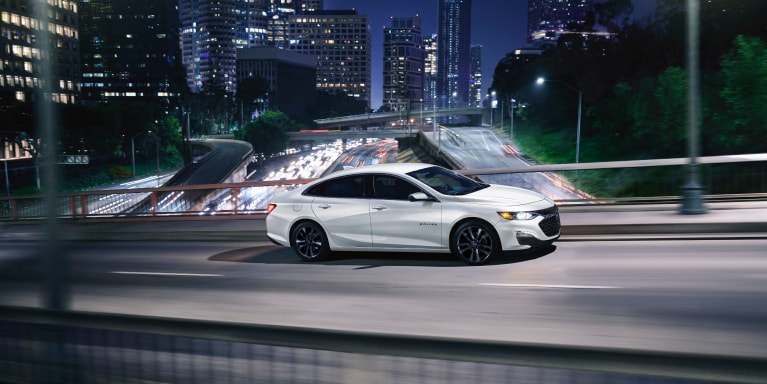 2025 Malibu driving in a city at night