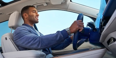 driver using the steering wheel