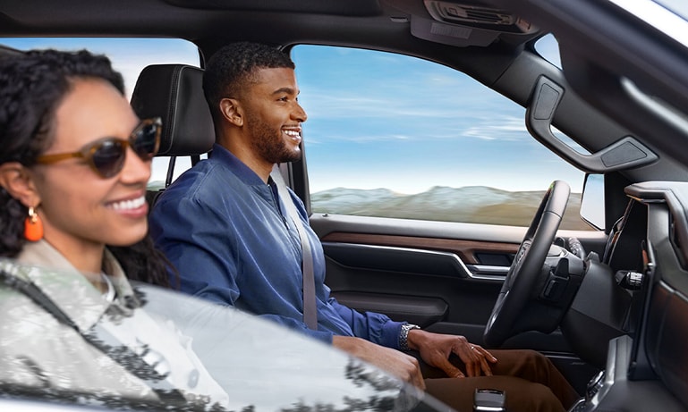 couple in the front seat using Super Cruise