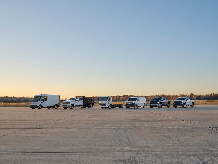 lineup of Chevy Fleet trucks and vans
