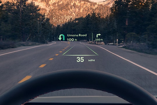 Interior close up of 27-inch OLED instrument cluster and navigation system inside Genesis G80