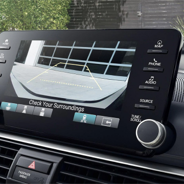 Interior shot of the dashboard technology showing rear-facing camera footage for backing up