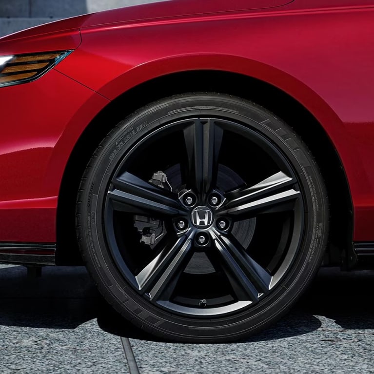 wheel and rim of a red honda accord hybrid