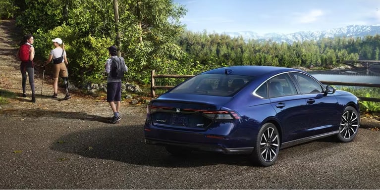 Blue Honda Accord parked near people hiking