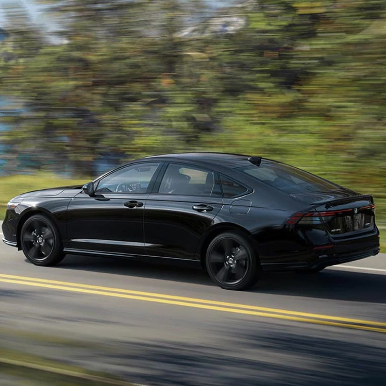 Block Honda Accord driving down the road