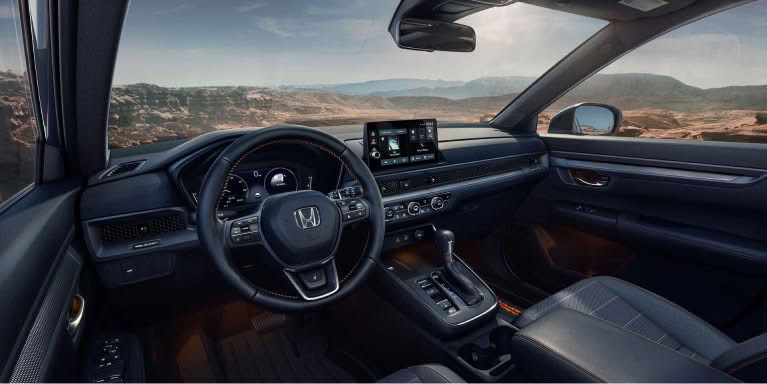 Interior shot of entire front dashboard from over drivers left shoulder perspective