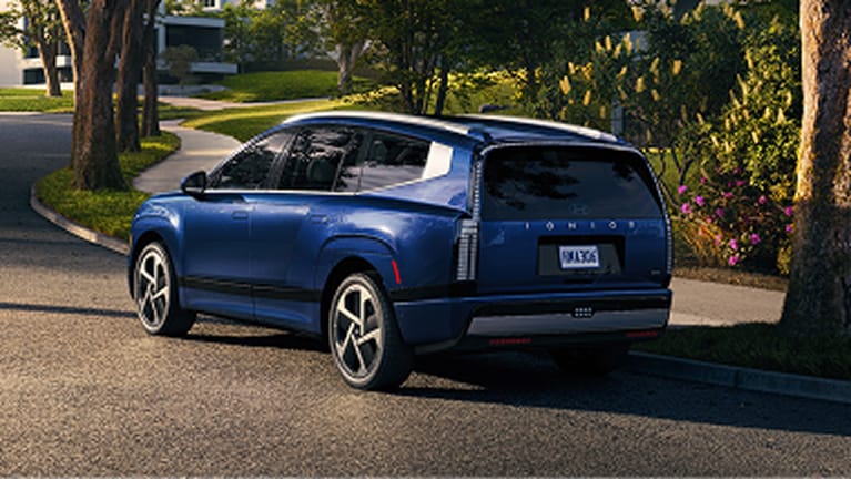 Blue Hyundai Ioniq 9 parked on residential street